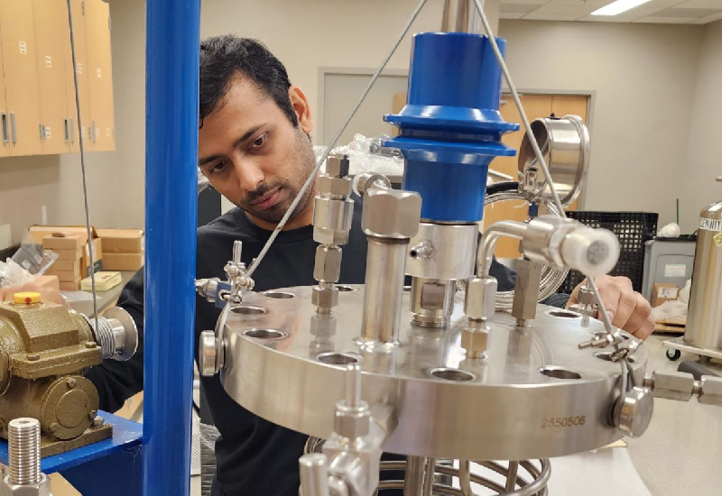 Oboro Labs researchers preparing cyclic polymer catalyst equipment in the laboratory